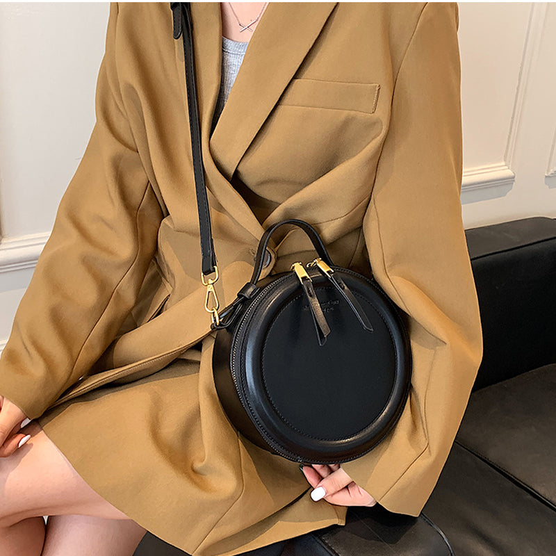 Sac rond noir femme, forme profonde, bandoulière amovible