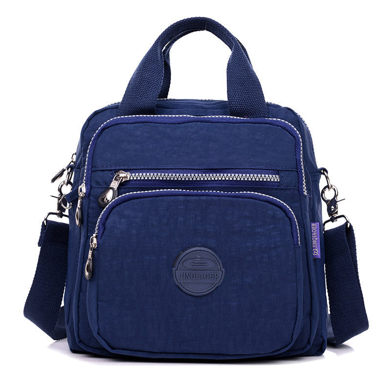 Sac bandoulière femme imperméable, trois façons de le porter, bleu marine foncé