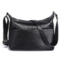 Sac besace femme à texture grainée, deux compartiments zippés, noir