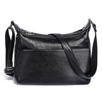 Sac besace femme à texture grainée, deux compartiments zippés, noir
