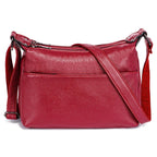 Sac besace femme à texture grainée, deux compartiments zippés, rouge foncé