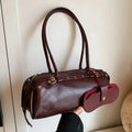 Sac porté épaule femme en similicuir, détails dorés, rouge foncé