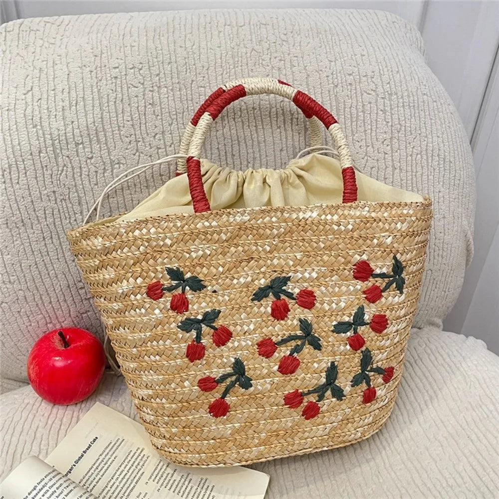Sac en paille brodé femme, motifs fruits et plage, à cordon