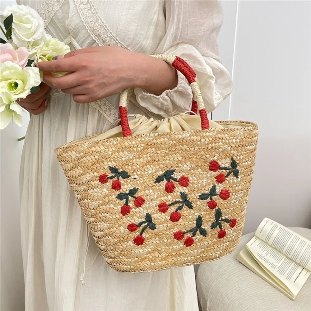 Sac en paille brodé femme, motifs fruits et plage, à cordon