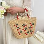 Sac en paille brodé femme, motifs fruits et plage, à cordon