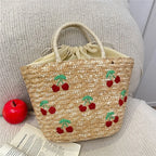 Sac en paille brodé femme, motifs fruits et plage, à cordon