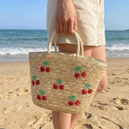 Sac en paille brodé femme, motifs fruits et plage, à cordon
