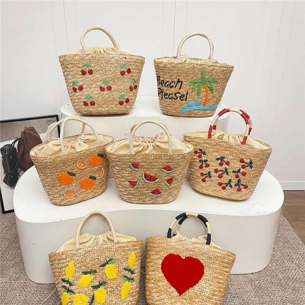 Sac en paille brodé femme, motifs fruits et plage, à cordon