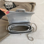 Sac bandoulière matelassé femme, anse rigide et longue chaîne