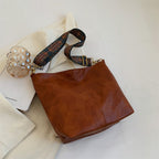 Sac seau allongé femme en similicuir, bandoulière en tissu à motifs, marron