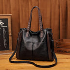 Sac à main femme noir à finitions marron, bandoulière amovible
