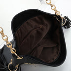 Sac à franges femme noir, clous étoiles dorés, poignée chaîne