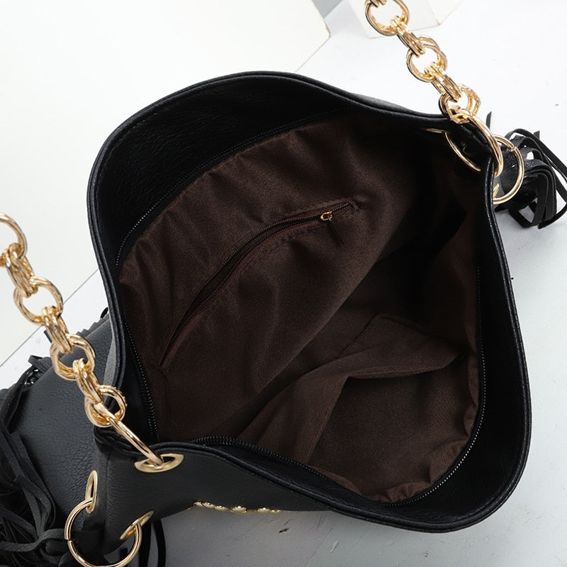 Sac à franges femme noir, clous étoiles dorés, poignée chaîne