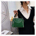 Sac à main vert bouteille en cuir fendu, bandoulière amovible