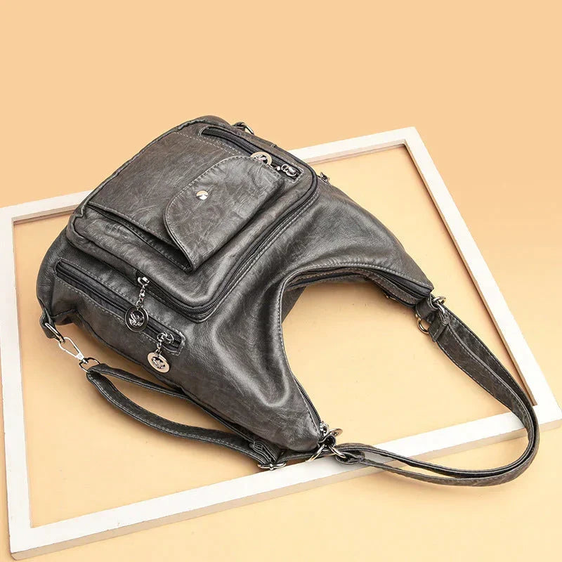 Sac porté épaule femme en cuir souple, multipoches, zippé