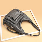 Sac porté épaule femme en cuir souple, multipoches, zippé