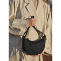 Sac selle femme en cuir grainé, format compact, quatre coloris, noir grainé