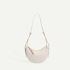 Sac selle femme en cuir grainé, format compact, quatre coloris
