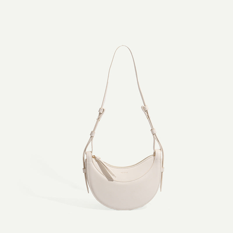 Sac selle femme en cuir grainé, format compact, quatre coloris