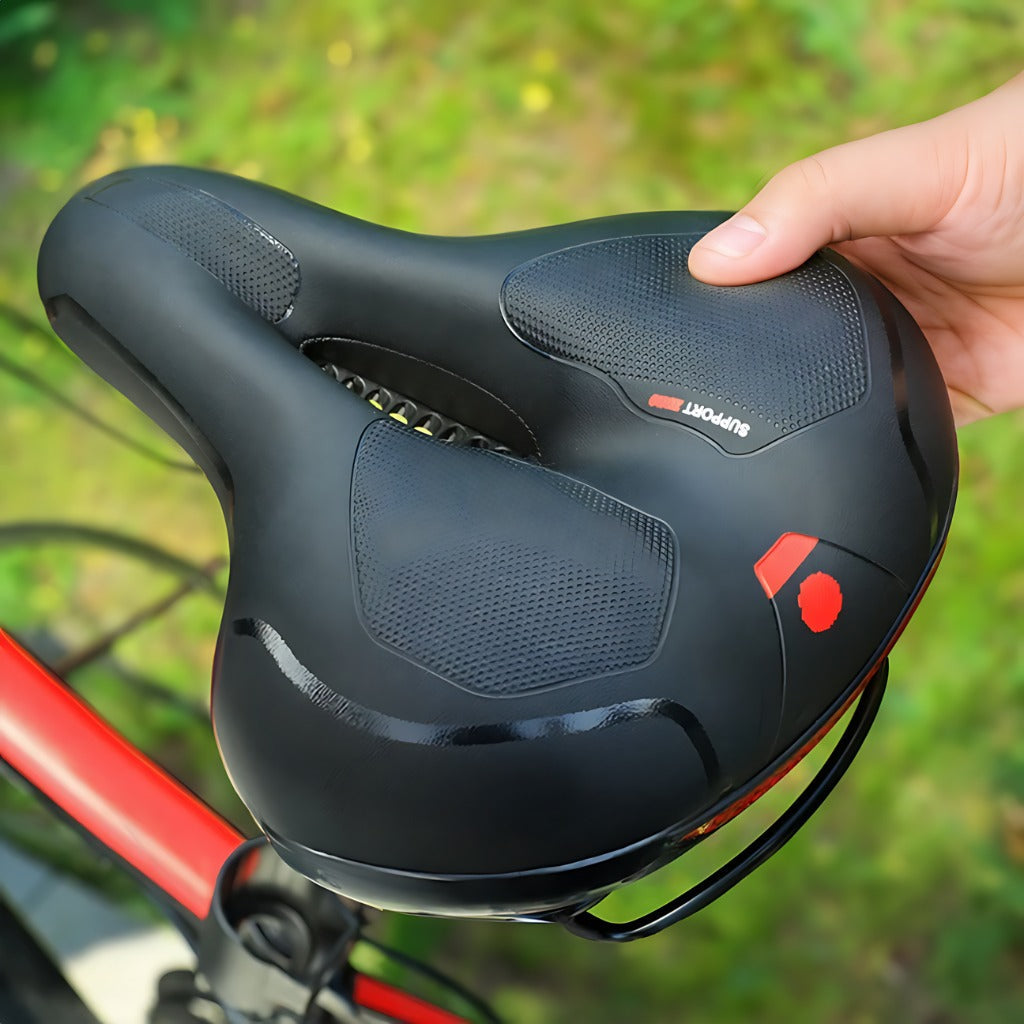 Selle de vélo confort évidée avec suspension et réflecteur