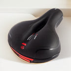 Selle de vélo confort évidée avec suspension et réflecteur