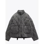Veste matelassée femme zippée à poches, piqûres arrondies, gris